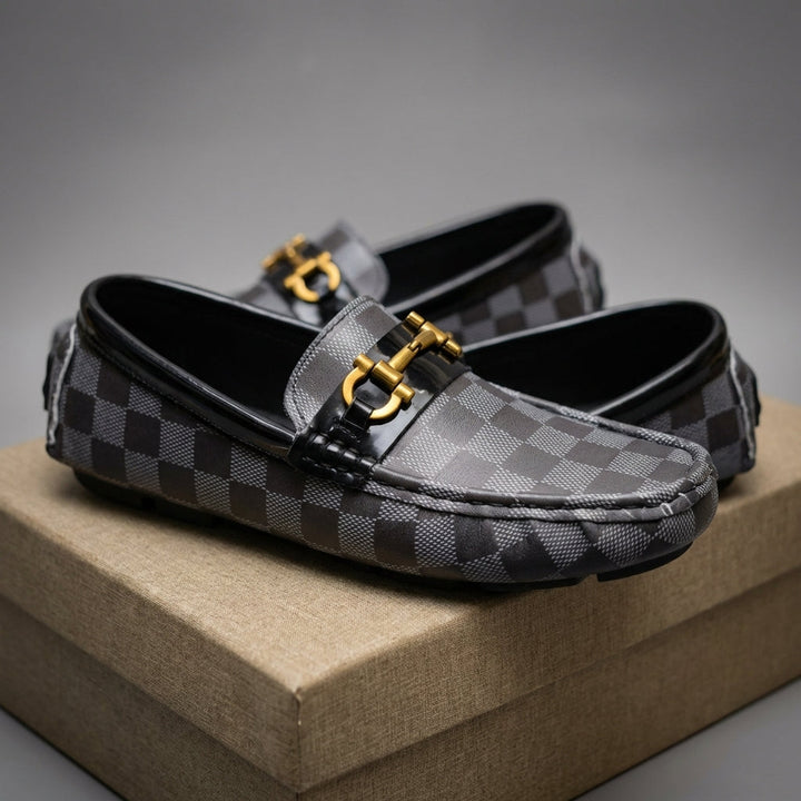 Men's black slip-on loafers, a comfortable and stylish choice for casual and smart occasions.
