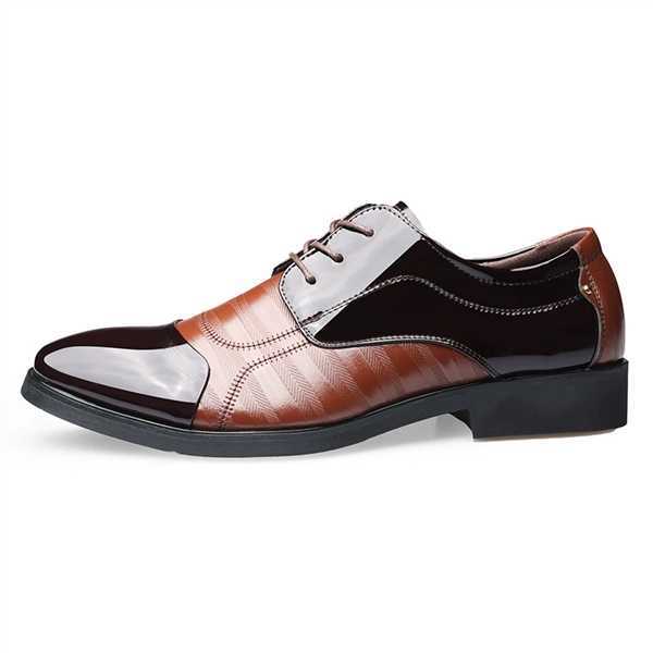 Overhead view of men's two-tone oxford dress shoes, showcasing classic elegant design and contrasting tones.