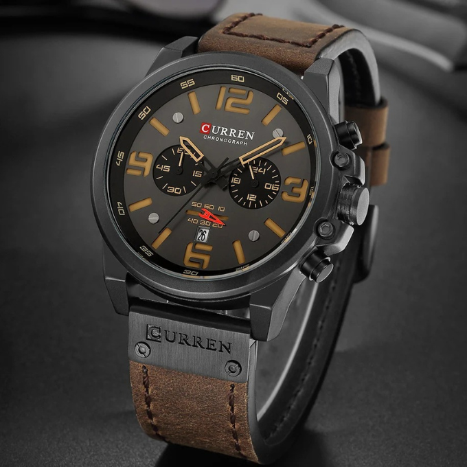 Elegant men's timepiece: silver-tone chronograph watch with a black dial & leather strap.