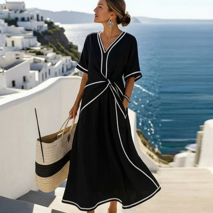 Graceful women's solid color flowing midi dress. Elegant design, perfect for summer parties & versatile wear.