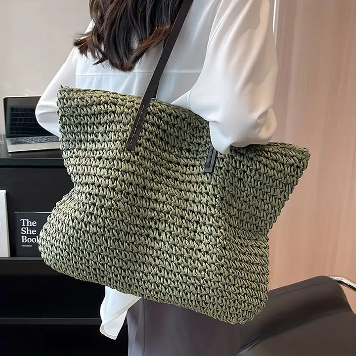 Chic woven straw oversized beach tote bag for women, ideal for a casual summer style.