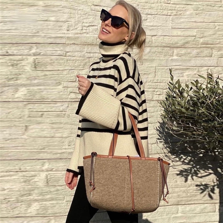 Versatile women's cozy turtleneck sweater in a neutral shade, perfect for chic fall and winter fashion looks.