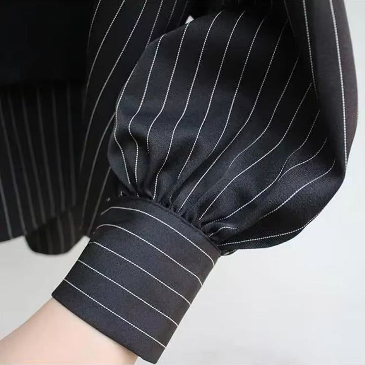 Crisp white women's layered blouse, an elegant and comfortable long-sleeve top for office or casual style.