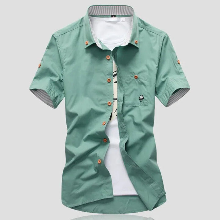 Men's relaxed fit short sleeve cotton button-up shirt with modern contrast stitching for summer.