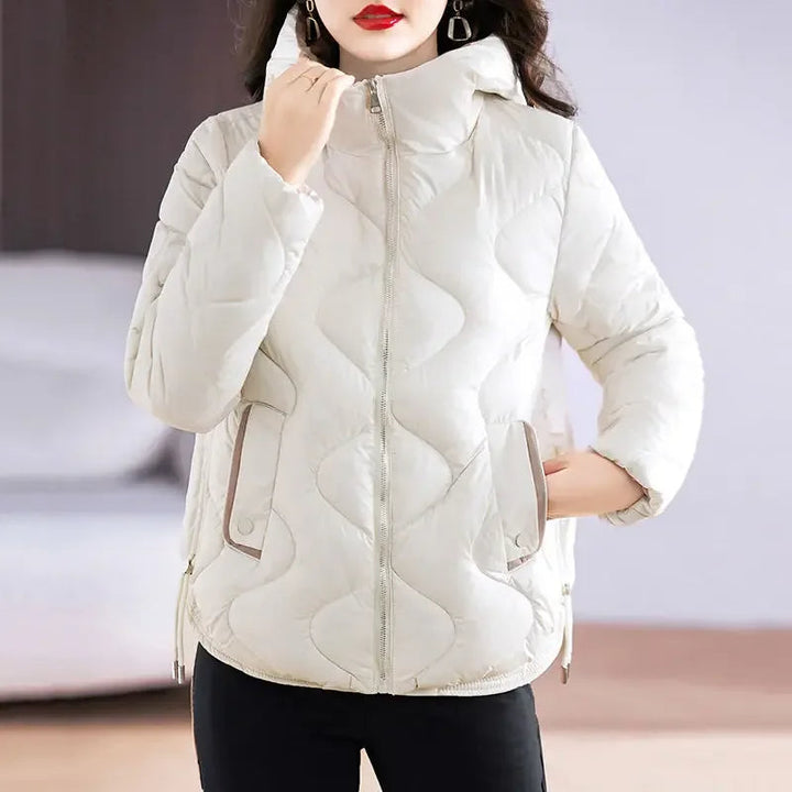 Close-up: Women's quilted puffer jacket, highlighting warm insulation and chic design for winter.