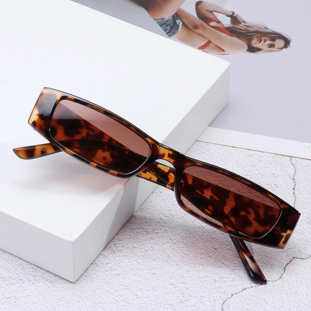 Lightweight polycarbonate women's retro eyewear, sleek slim shades with UV400 protection.
