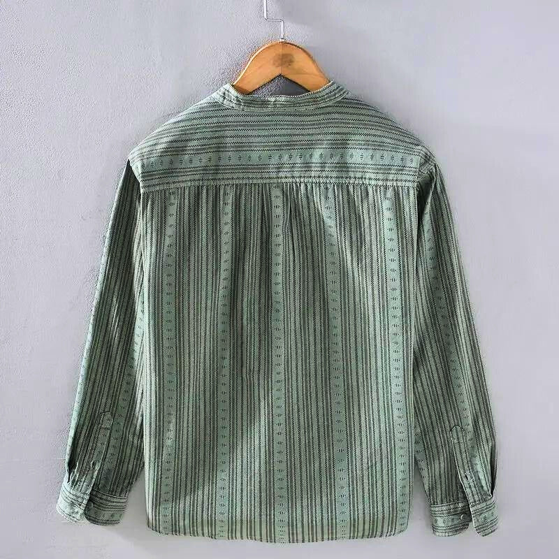 Chic green striped button-down shirt for women. Comfortable long-sleeve casual top, perfect for summer fashion & everyday wear.