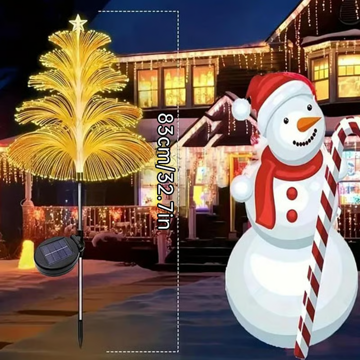 Solar Christmas tree lights illuminating a lawn, providing cheerful outdoor ambiance