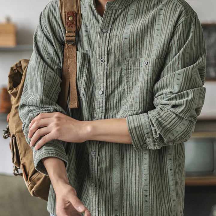 Relaxed fit women's apricot striped button-down shirt, a chic long-sleeve top for spring & summer casual style.