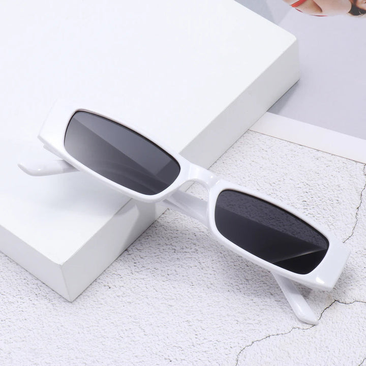 Close-up of women's slim shades, showcasing retro design & premium UV400 sun protection.