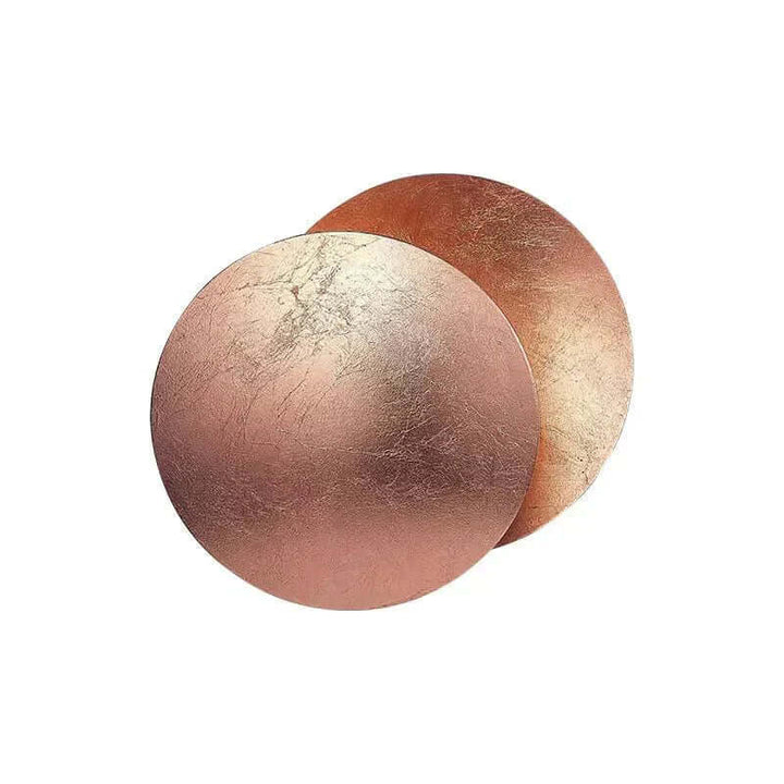 Goldene Wandleuchte mit Sonnenfinsternis-Effekt