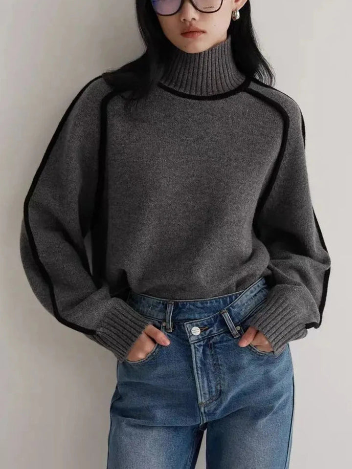 Relaxed fit women's cozy turtleneck sweater. Ideal for versatile everyday style and winter apparel.