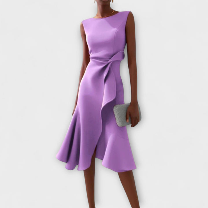 Close-up of the elegant asymmetric ruffle detail on a women's formal draped midi dress.