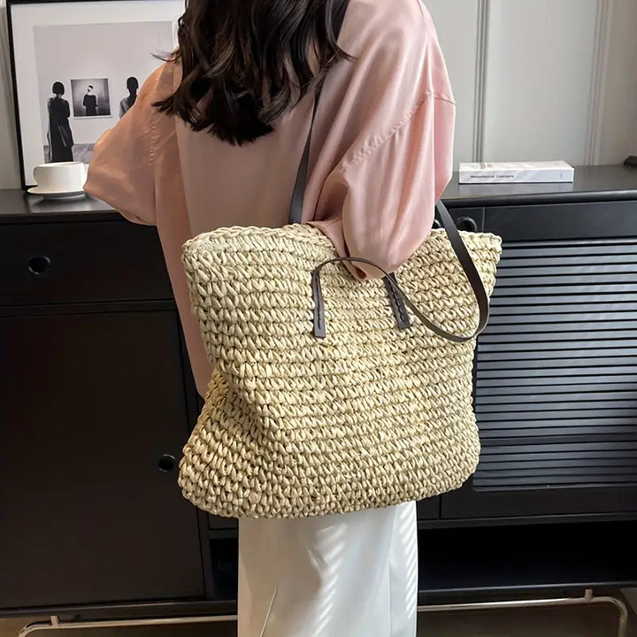 Empty women's oversized straw beach tote bag, ready for your ultimate summer vacation essentials.