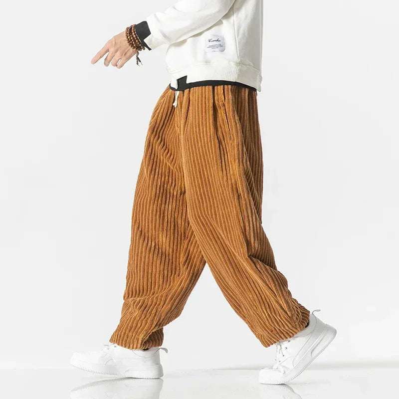 Ribbed fabric texture of comfortable men's wide-leg joggers, ideal for a relaxed fit, loungewear, or casual pants.