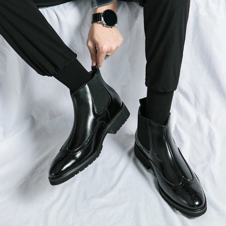 Fashionable men's slip-on chelsea boots, featuring detailed brogue, ideal for all-day wear.