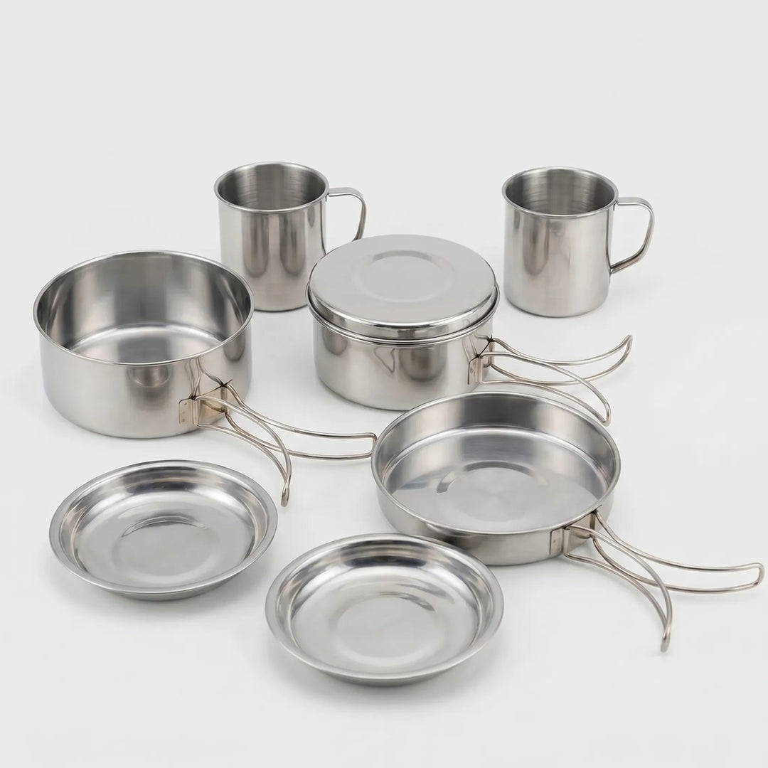 Compact 8-piece silver metal camping cook set, perfect for backpacking and portable outdoor kitchen needs.
