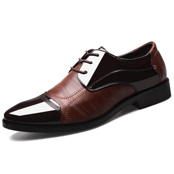 Pair of classic men's two-tone oxford dress shoes, elegant formal and professional business footwear.