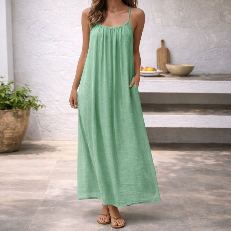 Casual women's beach dress, sleeveless spaghetti strap maxi for summer fashion.