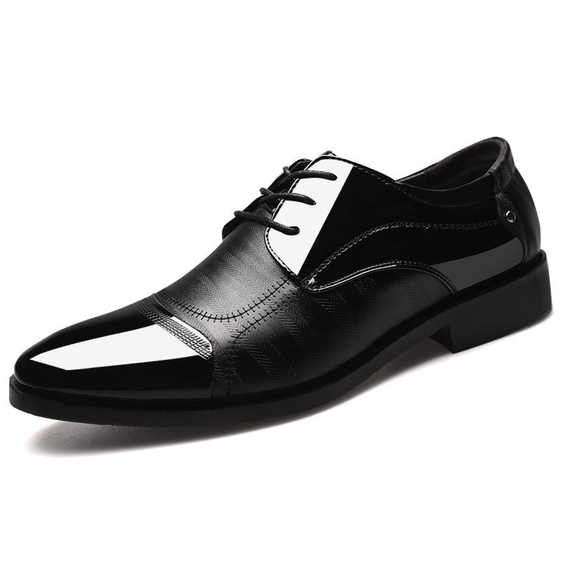 Men's two-tone oxford dress shoes, sophisticated formal footwear captured from a dynamic angle.