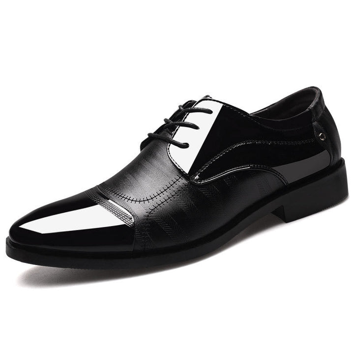 Men's two-tone oxford dress shoes, sophisticated formal footwear captured from a dynamic angle.