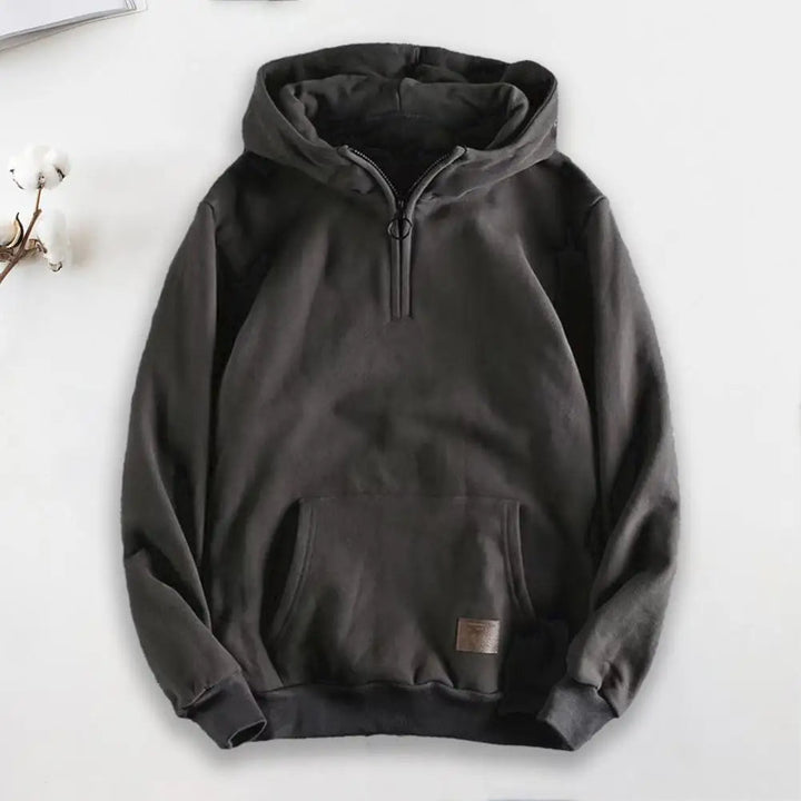 Grey quarter-zip men's hoodie, featuring soft fabric for comfortable and stylish casual wear.