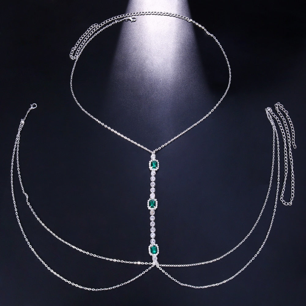 Silver-tone women's green crystal chest chain, an eye-catching rhinestone statement body accessory.