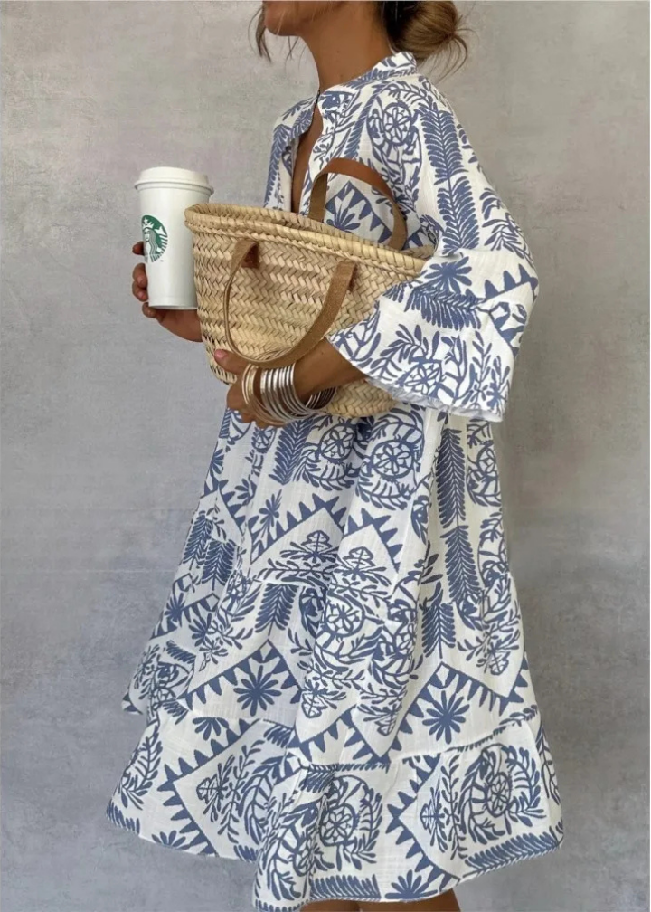 Comfortable oversized flowy midi dress for women with a vibrant boho print and long sleeves, great for casual elegance.