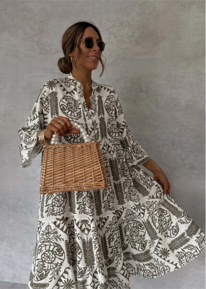 Stylish women's summer midi dress, oversized and flowy, showcasing a unique boho print with long sleeves for casual wear.