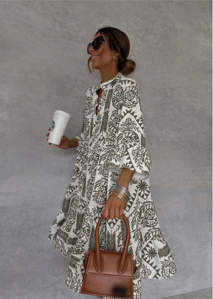 Close-up of a women's boho print oversized midi dress, highlighting its flowy fabric and elegant long sleeves.
