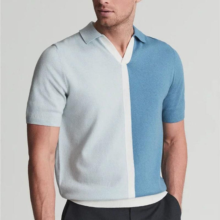Modern men's two-tone polo shirt. Classic fit with a trendy split color design. Great for stylish casual looks.