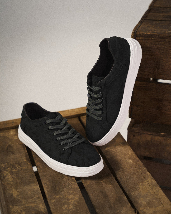 Close-up of premium fabric on versatile men's comfort sneakers, highlighting quality and refined style.