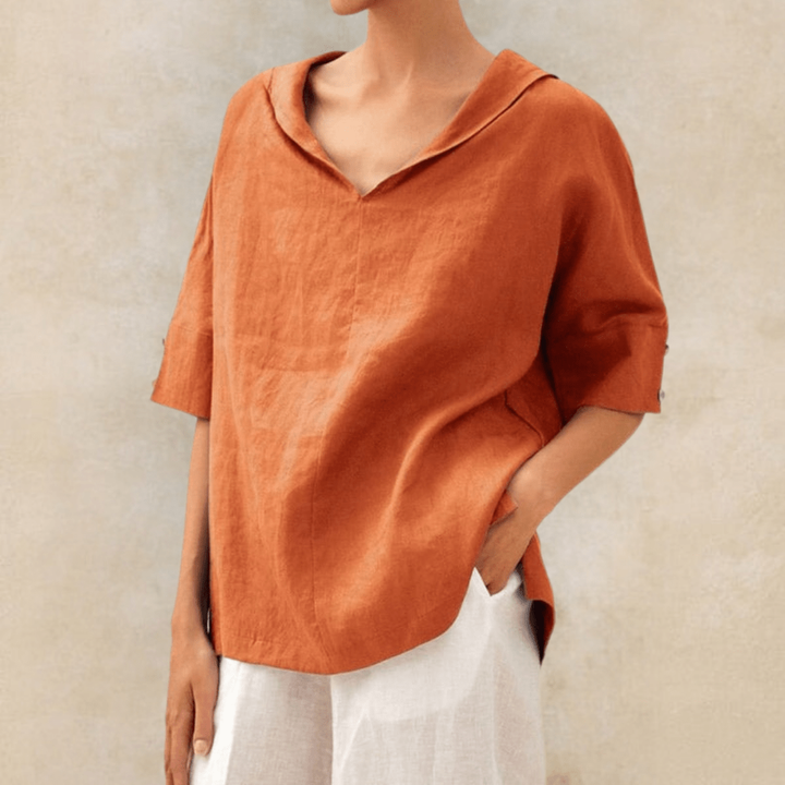 Relaxed fit oversized women's V-neck tunic blouse with collar & short sleeves. Ideal for comfortable, casual spring/summer style.