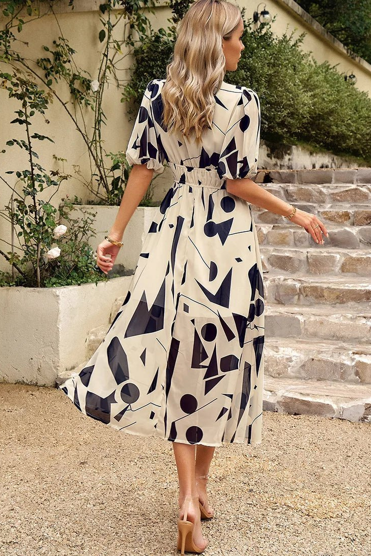 Full length view of an elegant women's floral puff sleeve midi dress for flattering style.