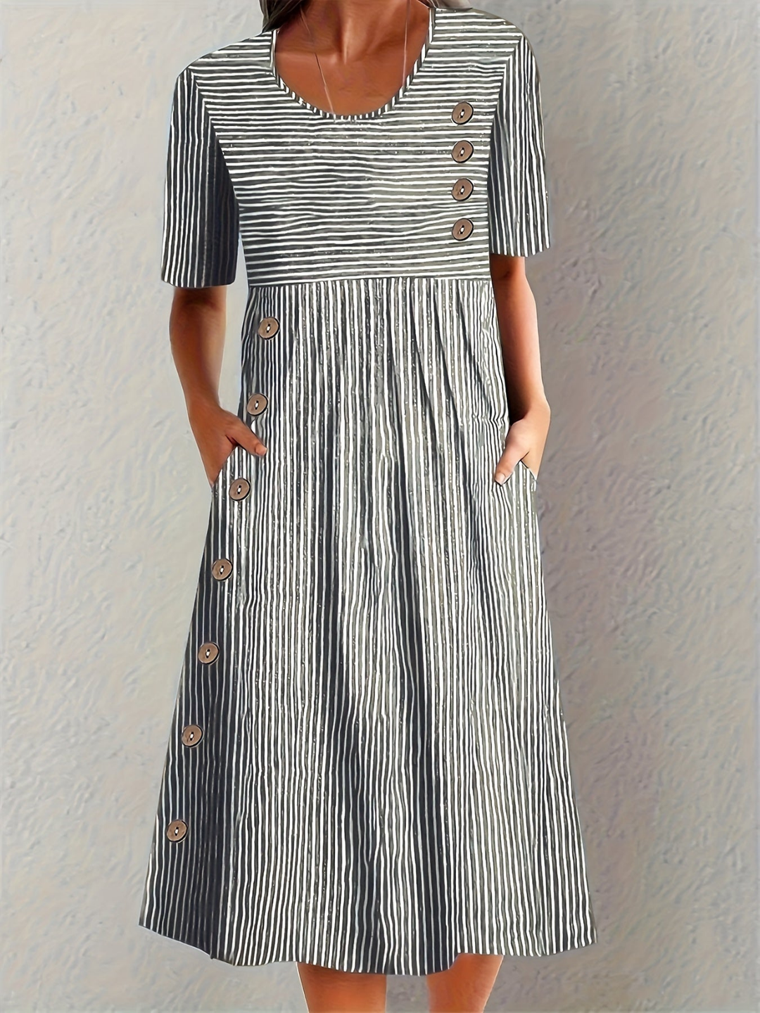 Stylish short sleeve striped midi dress for women, featuring a round neck & decorative buttons for a casual look.