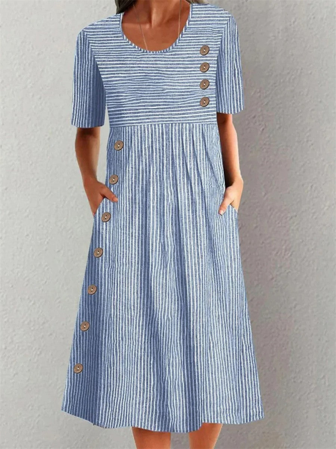 Women's striped midi dress with decorative button detail, round neck, and short sleeves, perfect for casual summer fashion.