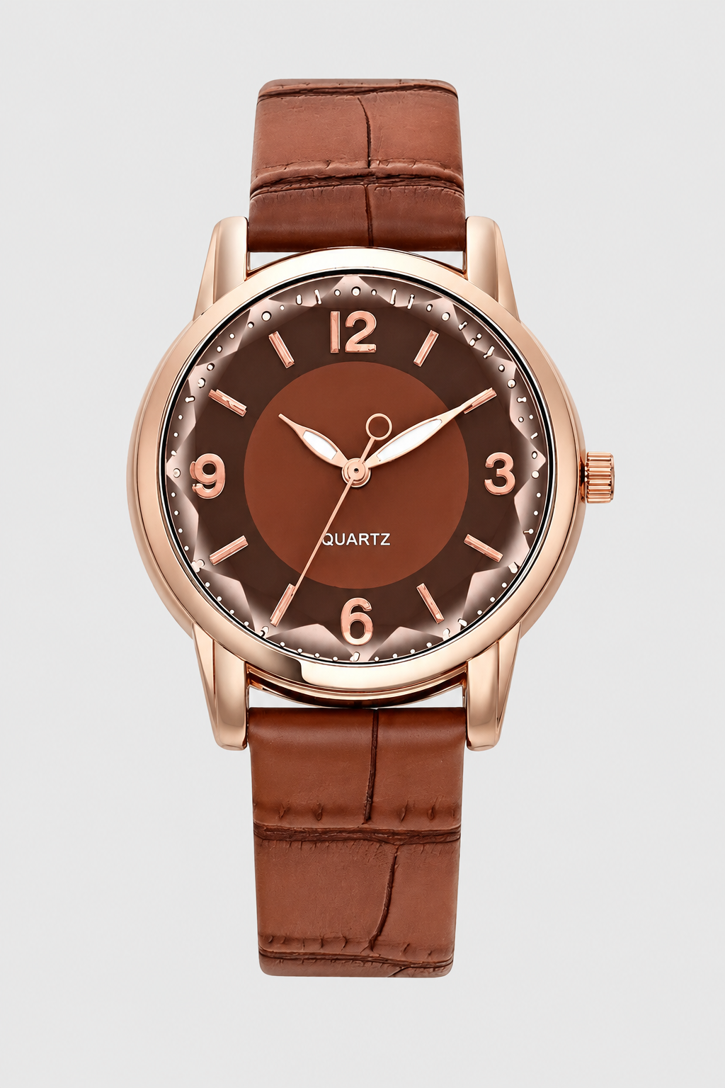 Close-up of a women's elegant watch featuring a finely embossed strap & minimalist dial.