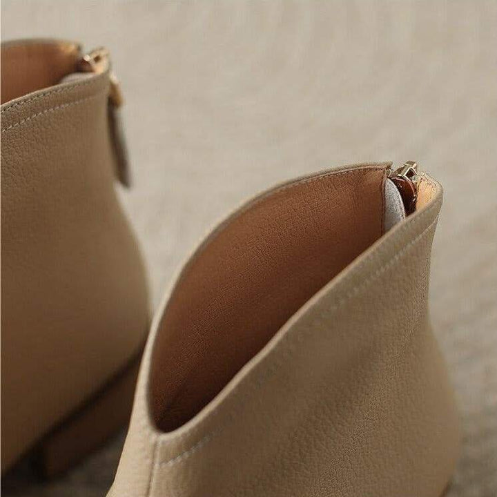Versatile slip-on pointed toe ankle boots, essential for a woman's chic and comfortable wardrobe.