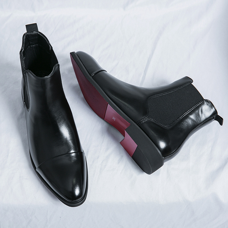 Formal men's black Chelsea dress boots with unique signature red sole. Ideal for sophisticated looks.
