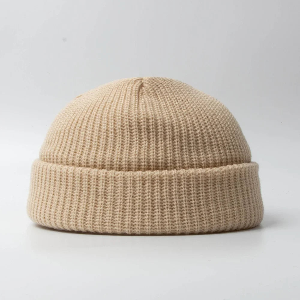 Unisex knit beanie skull cap in a solid color, perfect for winter warmth & casual style.
