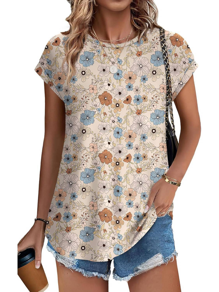 Comfortable women's cap sleeve top, vibrant botanical leaf pattern, great for summer.