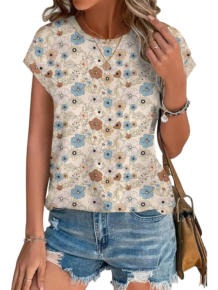 Women's fashion top, cap sleeve, with an eye-catching botanical leaf print.