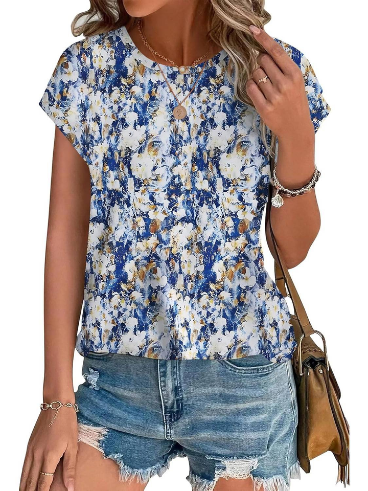 Chic women's casual top with botanical leaf pattern and flattering cap sleeves.