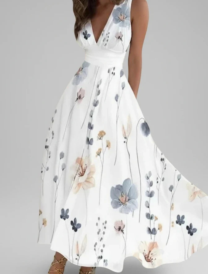Woman wearing a vibrant floral V-neck A-line midi dress, showcasing its elegant sleeveless design for summer.
