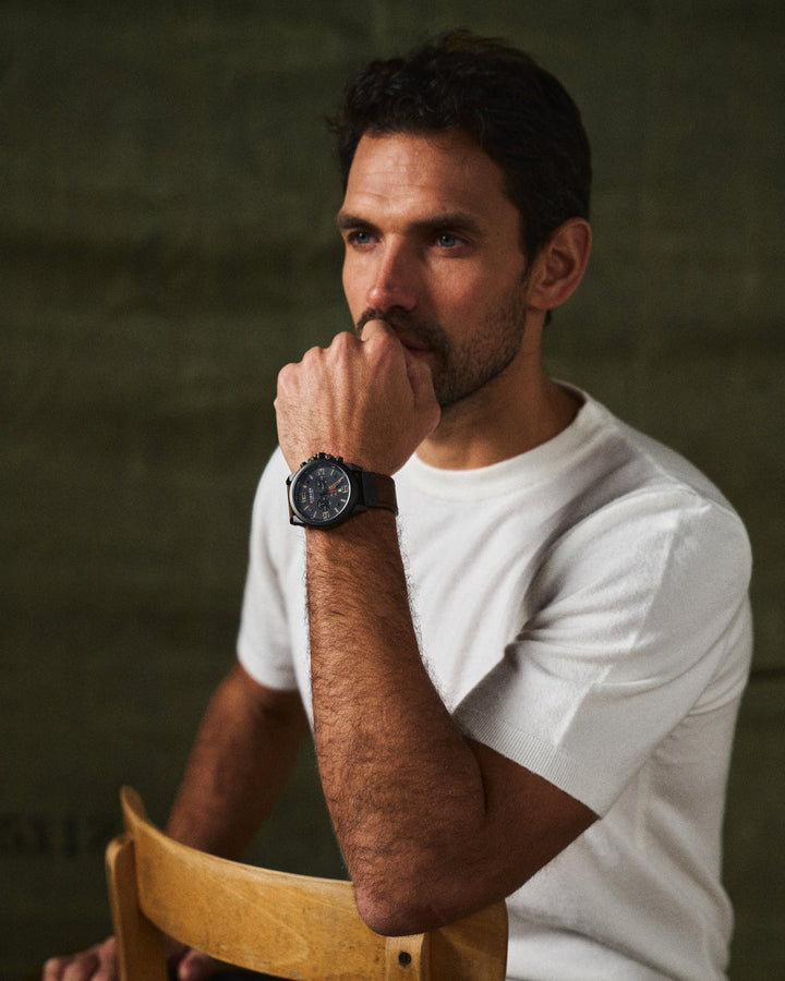 Timeless men's accessory: stainless steel chronograph watch with a blue dial & brown leather.