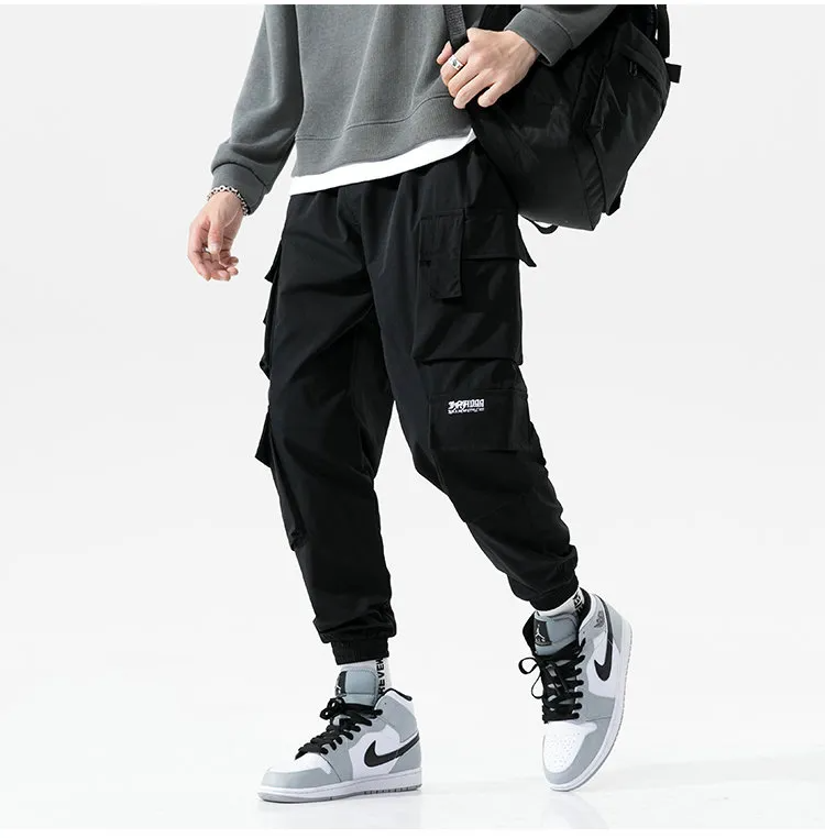 Men's athletic-style cargo joggers in black, offering both comfort and street-ready fashion.
