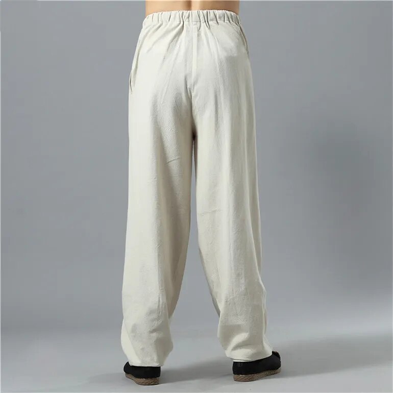 Side view of unisex Kodama baggy pants, relaxed fit, highlighting the comfortable, loose silhouette for casual wear.