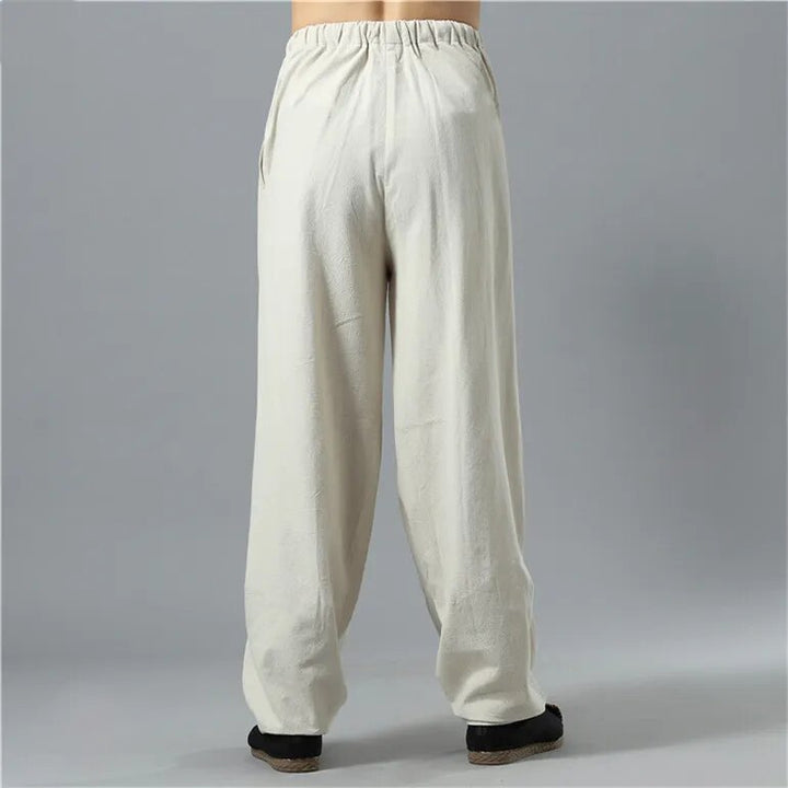 Side view of unisex Kodama baggy pants, relaxed fit, highlighting the comfortable, loose silhouette for casual wear.