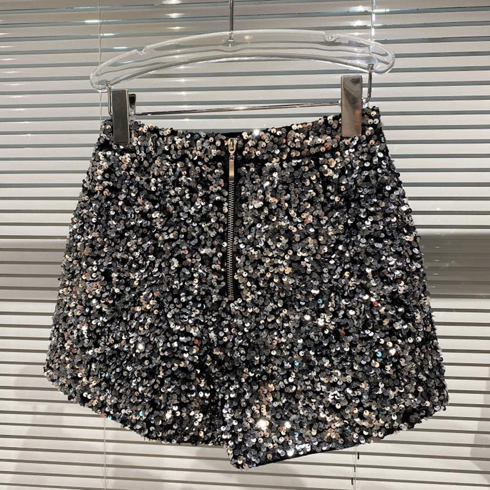Stylish women's glitter shorts for a chic summer fashion statement. Trendy high-waist shimmer shorts, ideal for party wear.