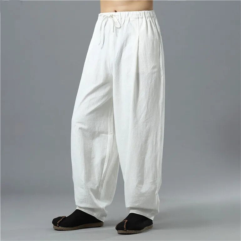 Person walking in unisex Kodama relaxed baggy pants, loose & comfortable fit, perfect for everyday casual movement.